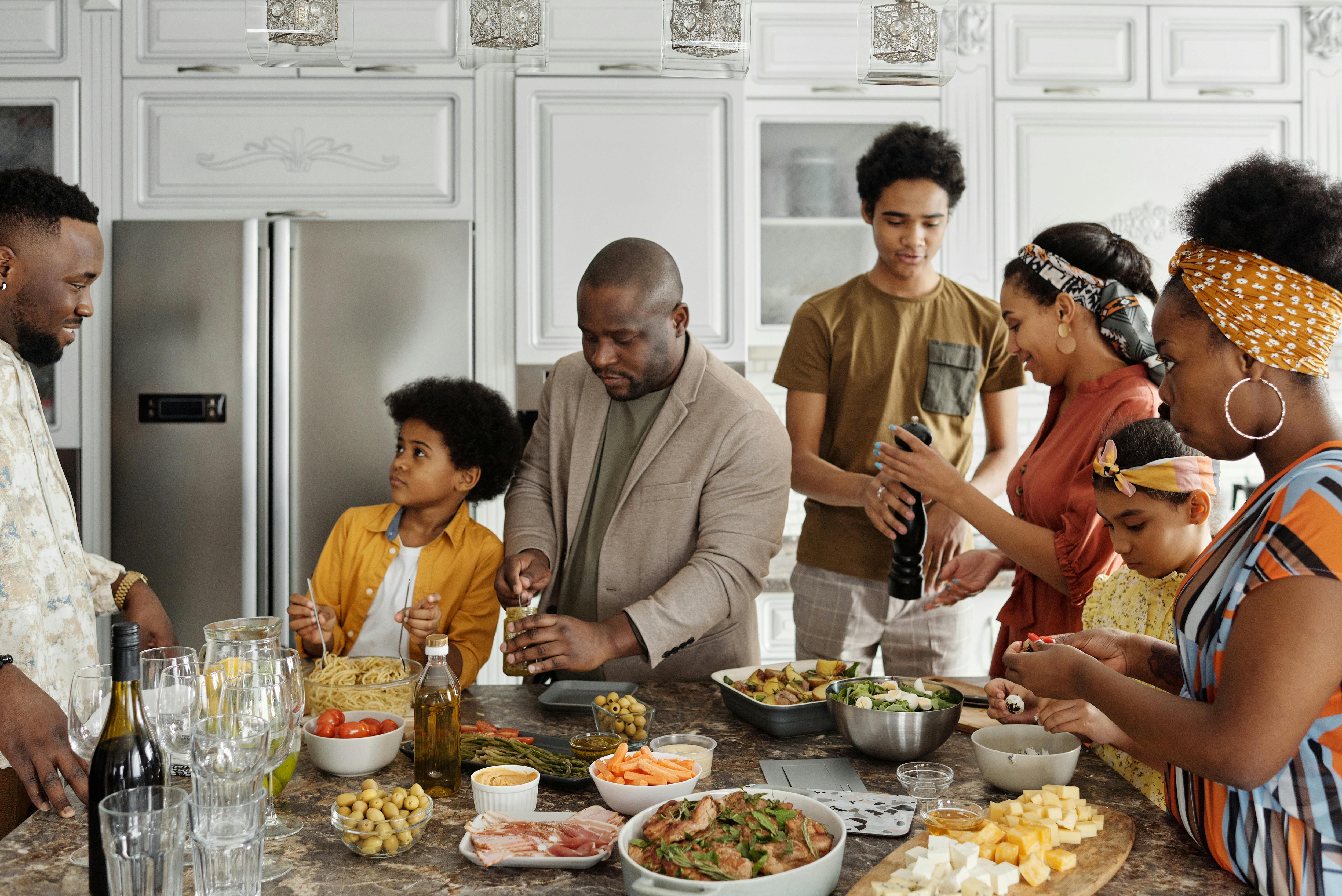 family gathering in kitchen for a big meal